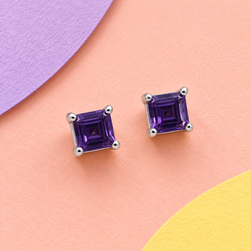 K1028: one pair of 4 mm square baguette cut amethyst ear studs in four claws 925 sterling silver settings.